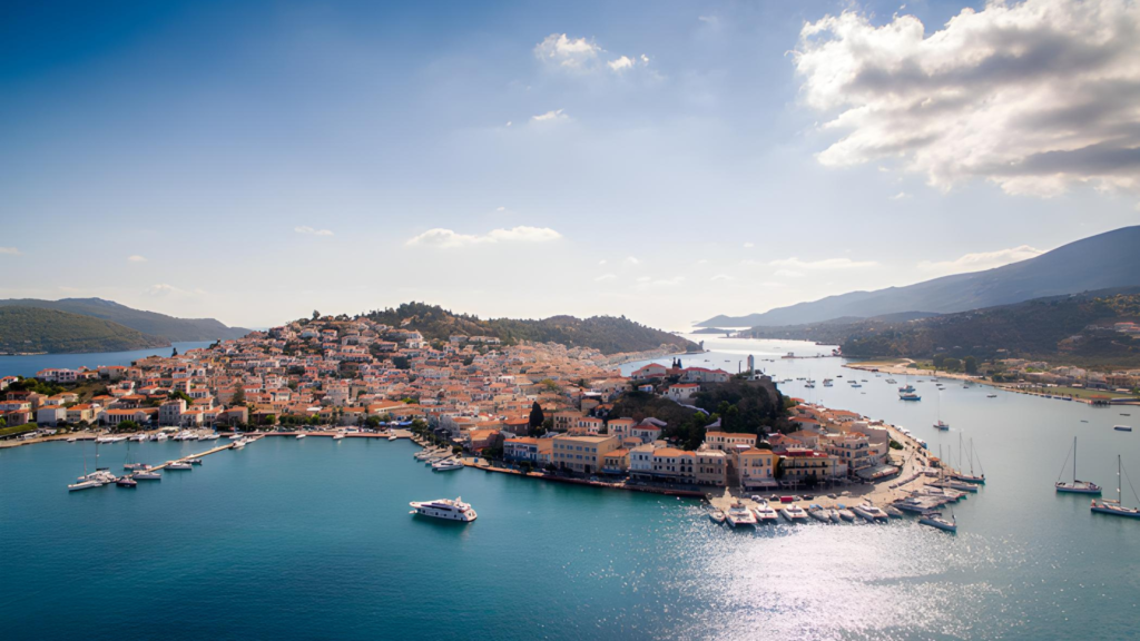 Port of Piraeus in Athens, Greece, with ships and a busy harbor coastline, illustrating best mediterranean cruise itineraries.