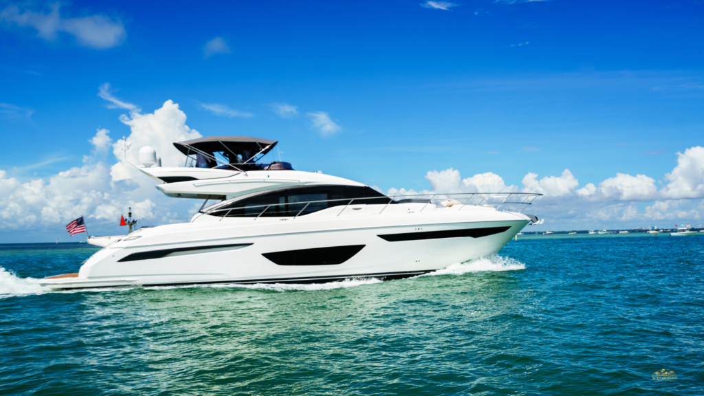 Luxury boat rental Miami with a sleek yacht cruising past the Miami, Florida skyline on bright blue water.