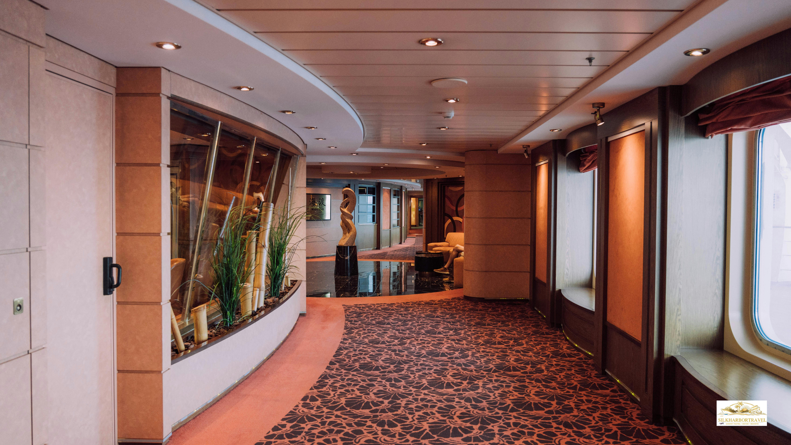 Luxury cruise corridor with an elegant hallway design, warm lighting, and refined upscale finishes