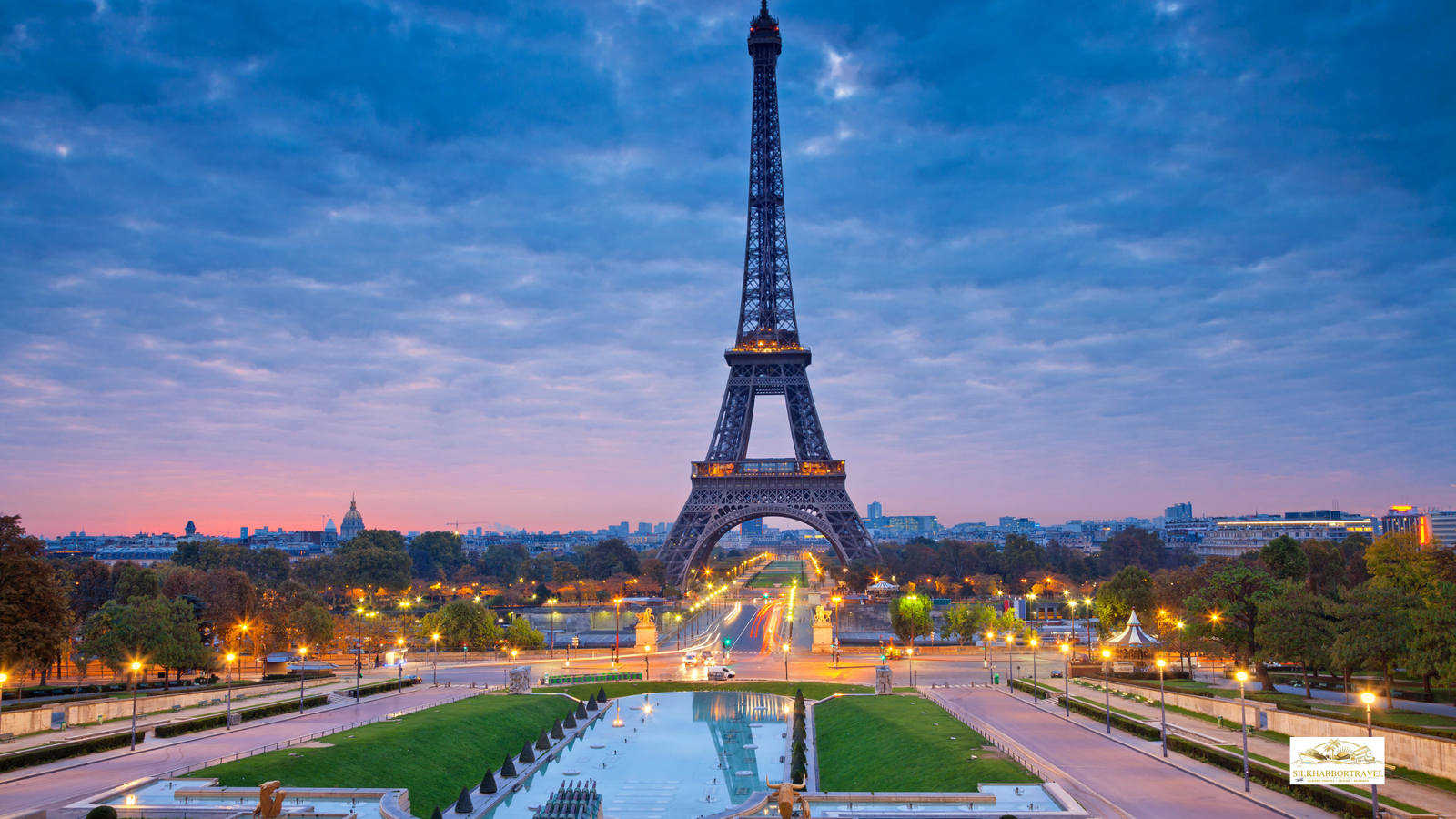 Luxury hotel in Paris France sunset view featuring the Eiffel Tower glowing in warm light