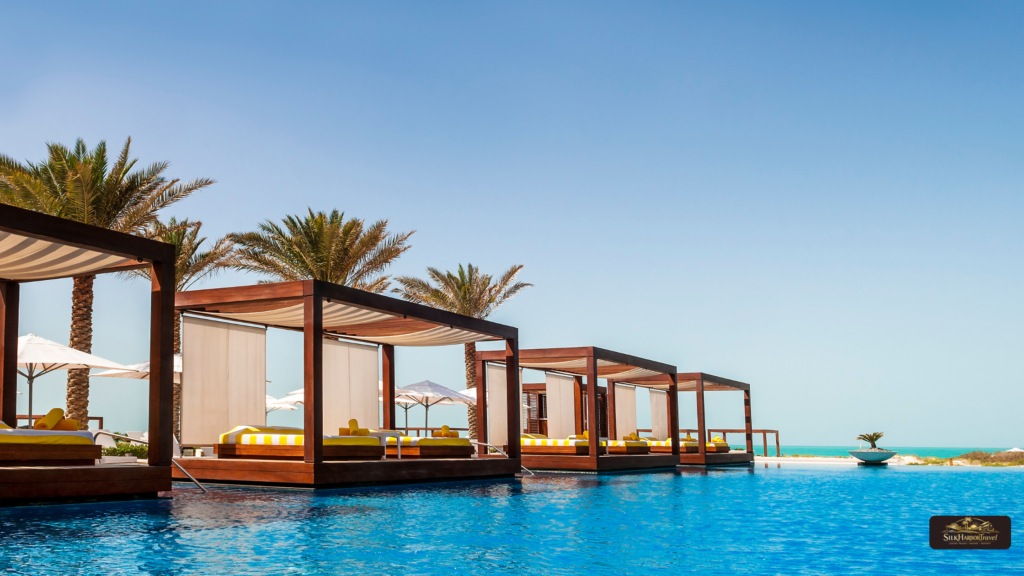 Luxury in Thailand overwater villas with glass walls above turquoise water, featuring modern private decks and panoramic ocean views.