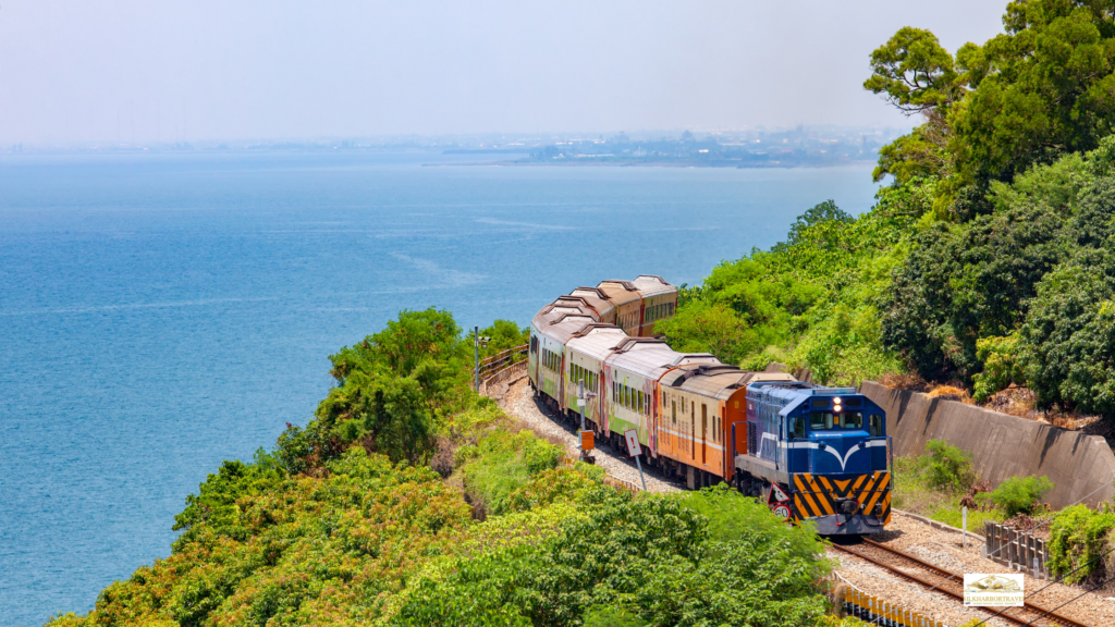 Luxury train trips featuring a train on a mountainside with a stunning ocean view