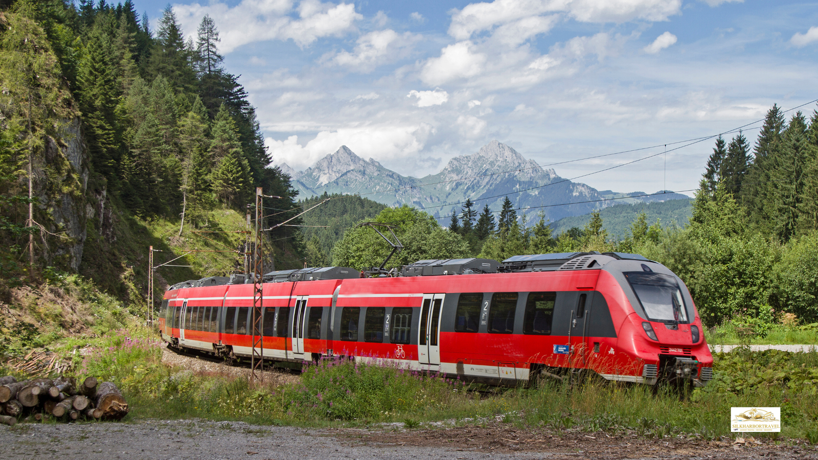 Premium rail journey traveling through Tyrol with Alpine peaks, green valleys, and mountain villages in view