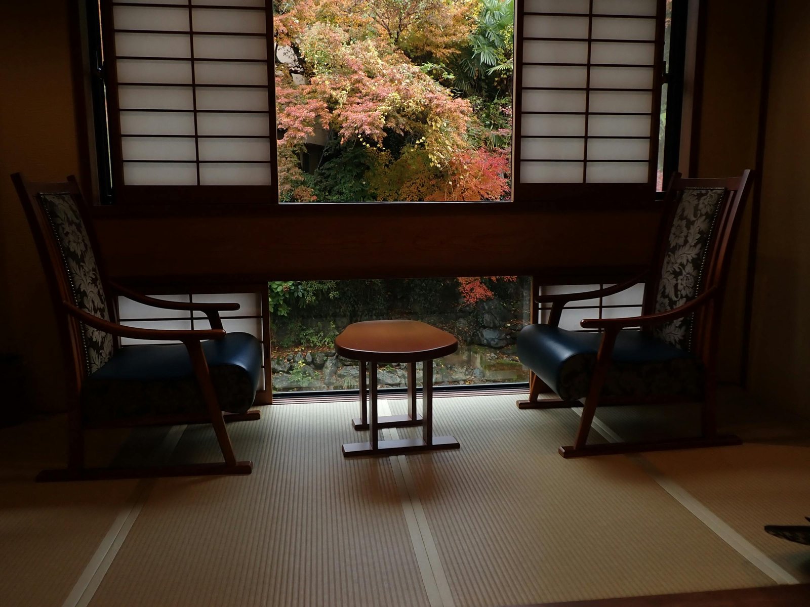 Traditional Japanese ryokan room with garden view for a luxury Japan itinerary in Hakone or Kyoto