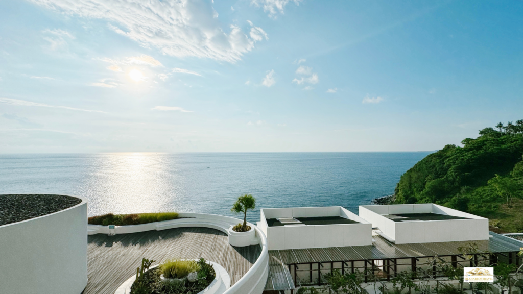 Luxury hotel in Greece overlooking the sea, showing a refined resort setting for travelers wondering if a club level hotel upgrade is worth it.
