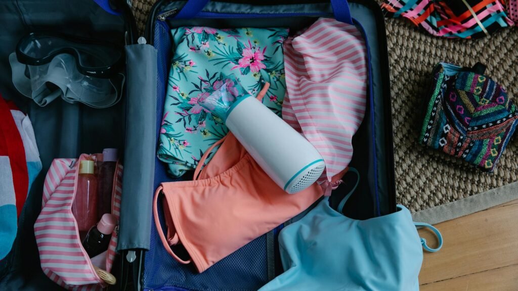 Pexels image by Timur Weber, used under Pexels License. Source: https://www.pexels.com/photo/clothes-and-goggles-inside-a-suitcase-9186211/