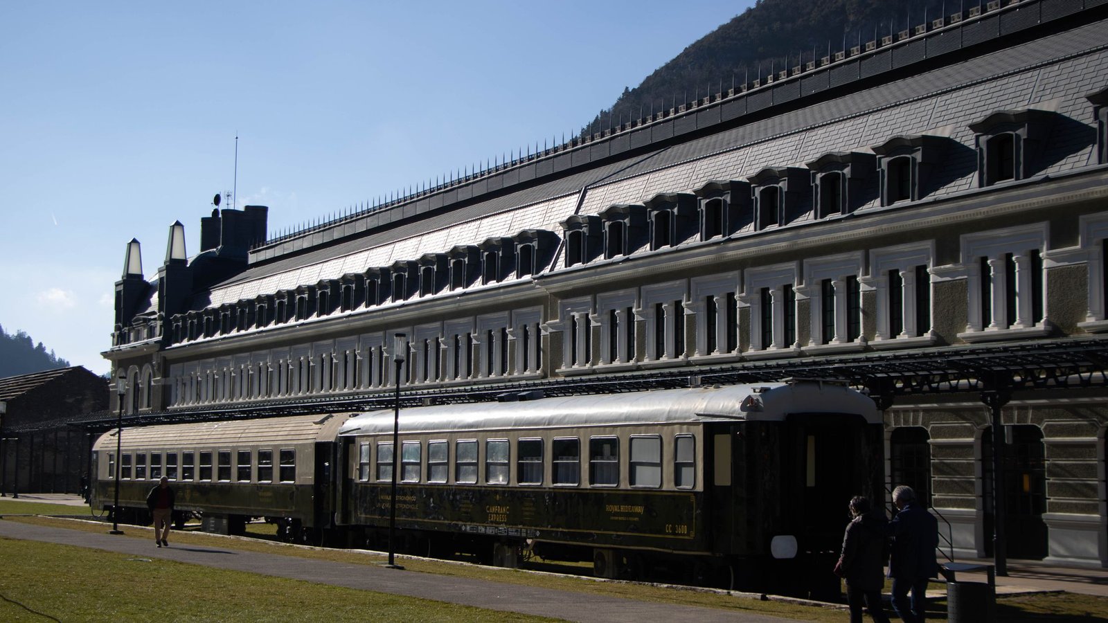 Classic train at a grand European station for the best luxury train journeys for couples