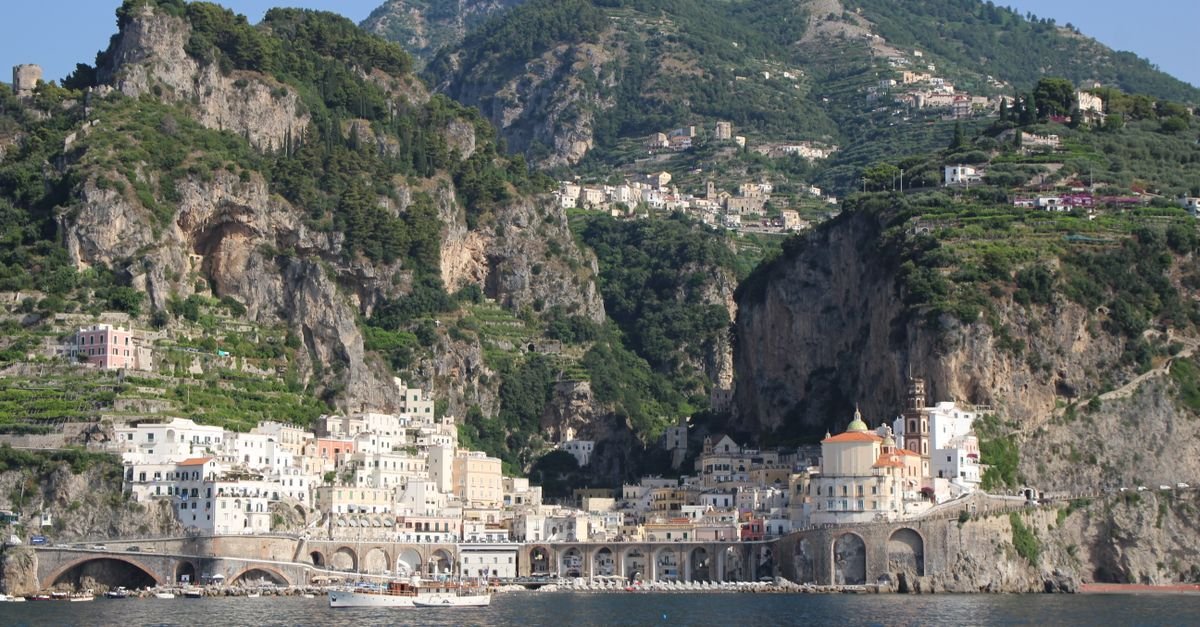 Cliffside Italian coastal town above a blue sea