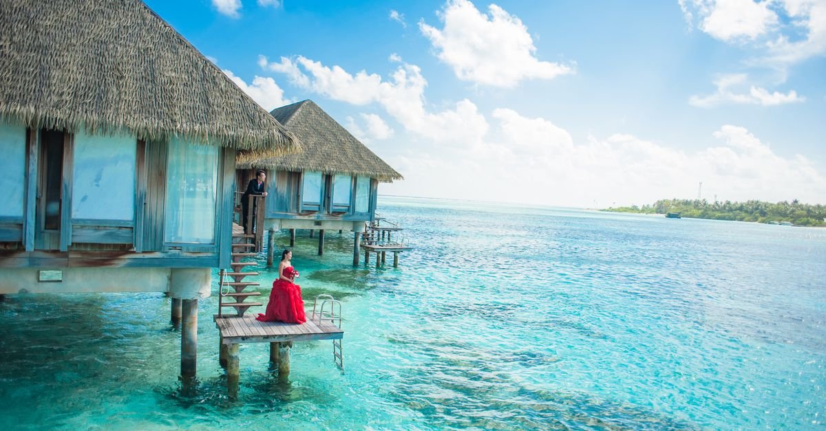 Overwater bungalows on a turquoise tropical lagoon