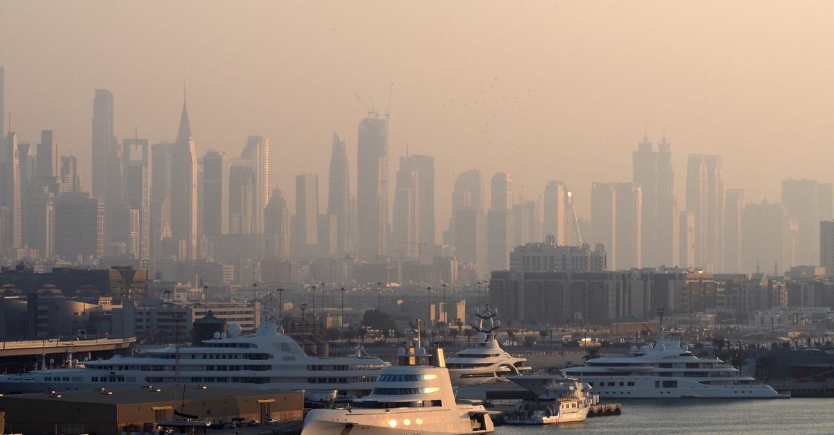 Modern high-rise skyline rising above a coastline