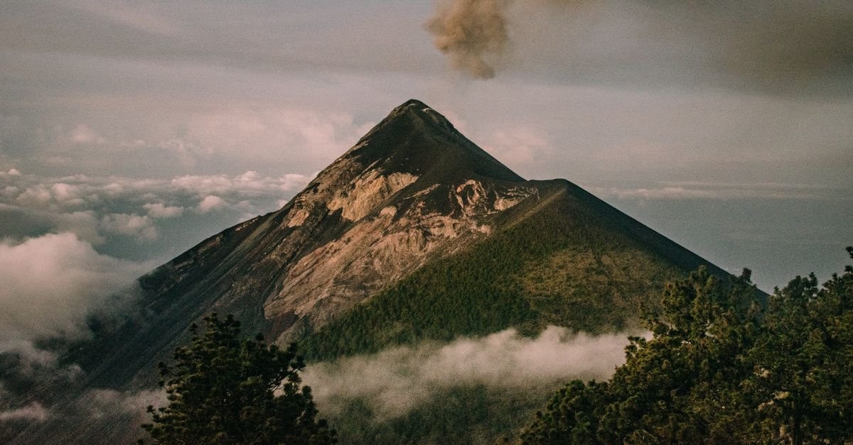 Twin volcanic peaks rising from a tropical coastline