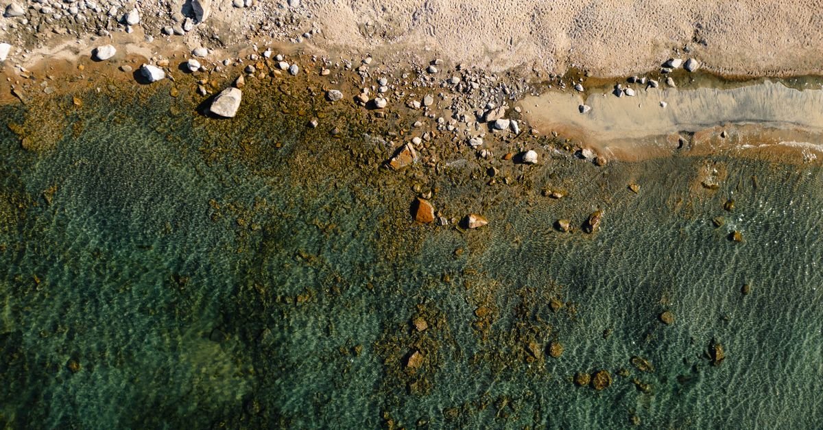 Turquoise shallow water meeting a bright white sand beach