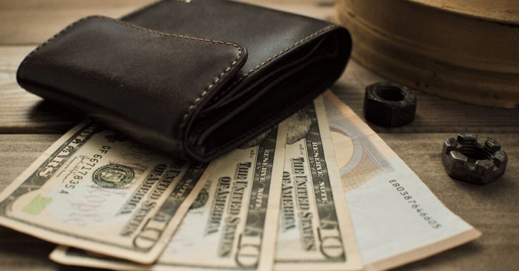 Notes and a wallet resting on a table